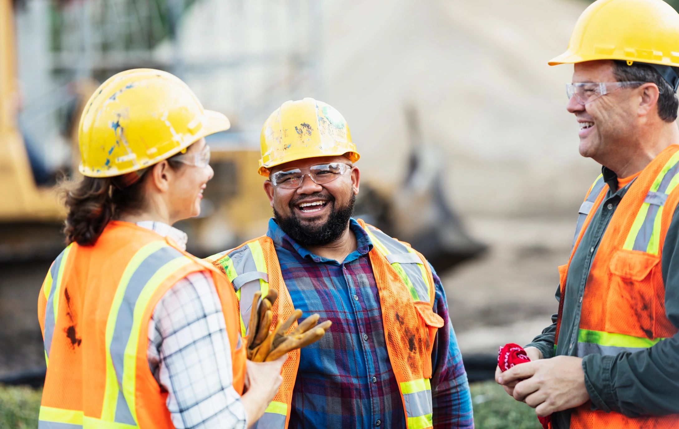 Construction team in safety gear on a job site
