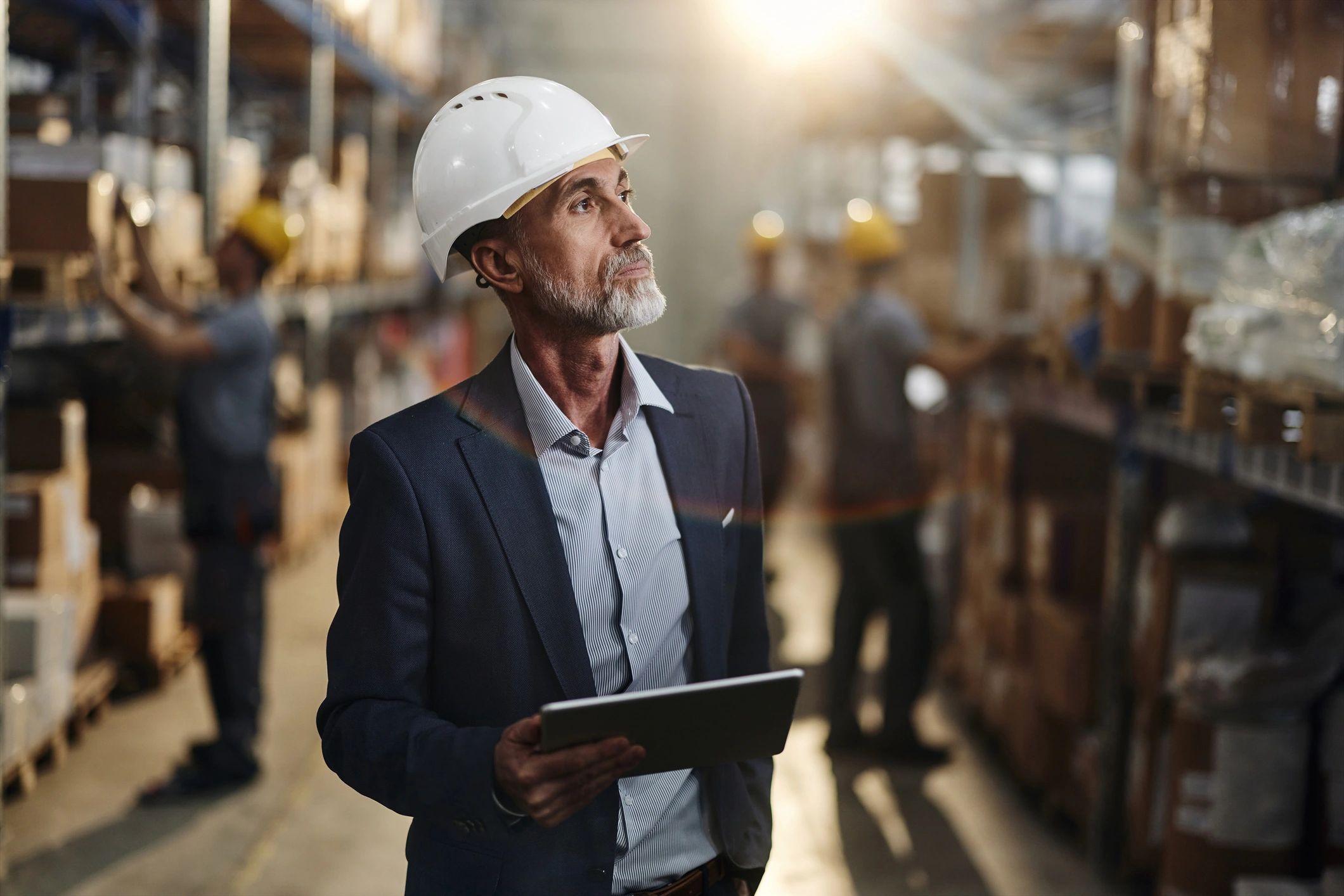 Facility professional reviewing work on a tablet